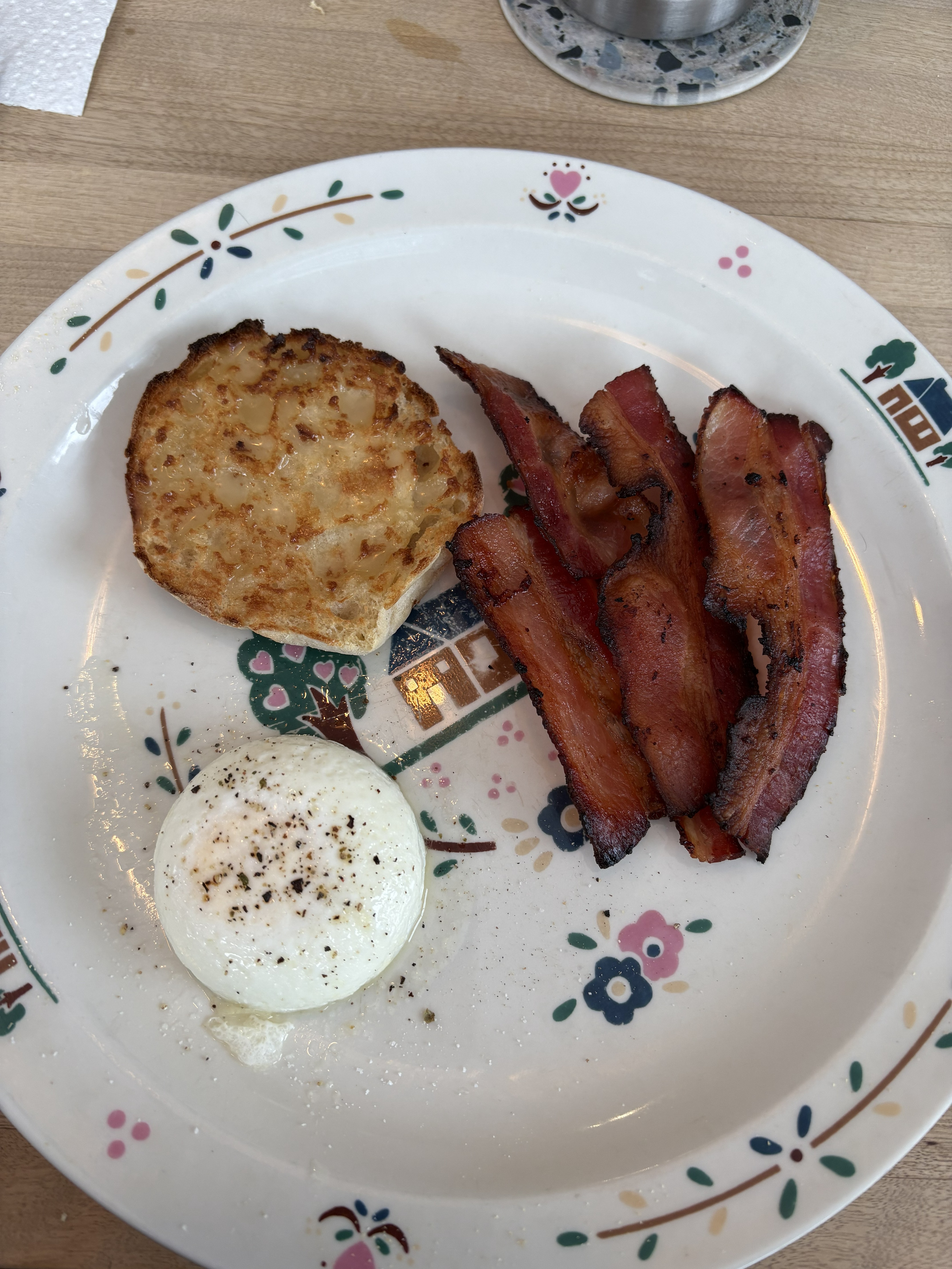 Photo of thick-cut smoked bacon, sizzling